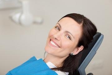 tooth extractions | smiling woman at dedham dentist