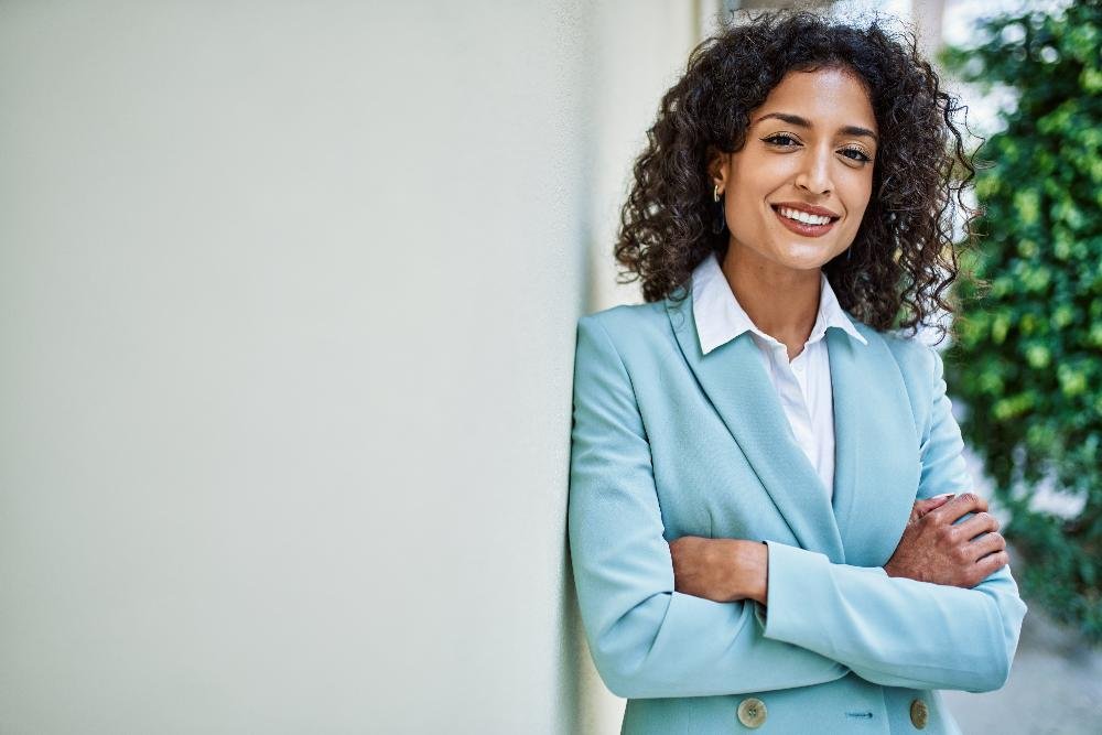 woman in blue jacket smiling | teeth whitening dedham ma