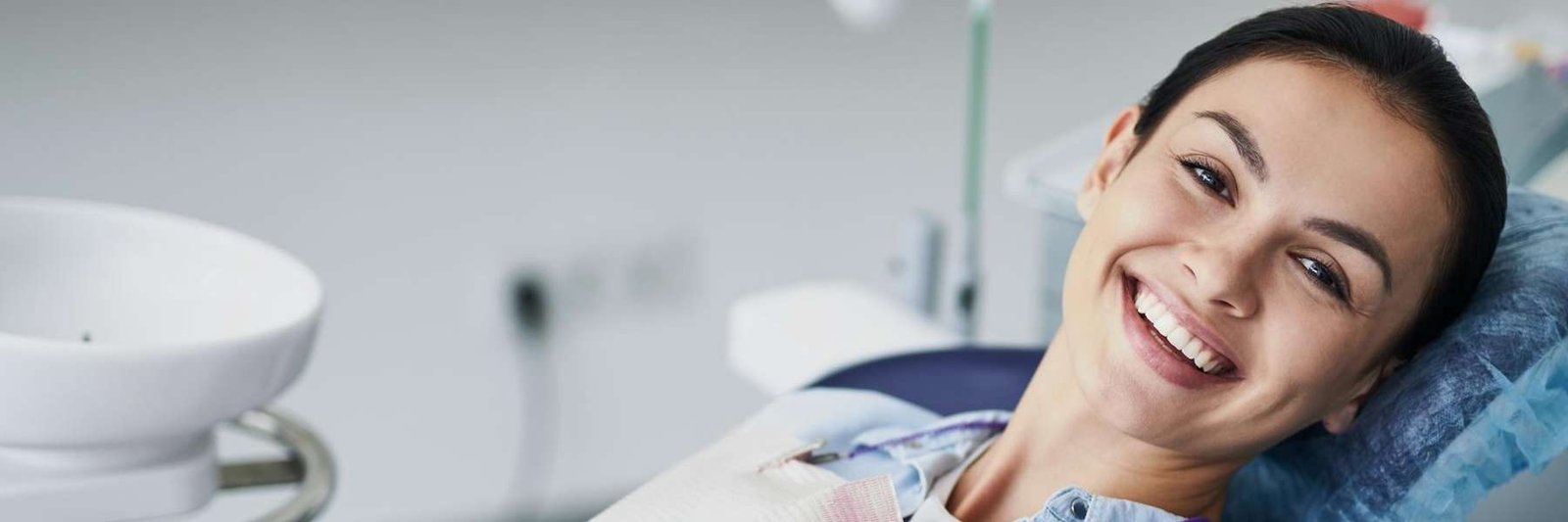 woman smiling after emergency dental care in norwood