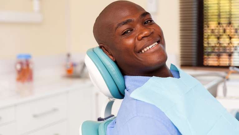 cosmetic dentist norwood | man at dentist
