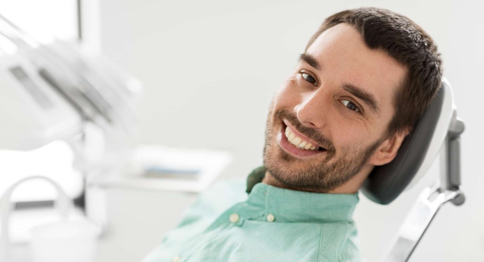 teeth whitening dedham | man at dentist